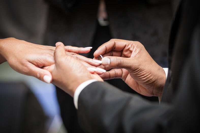 Photograph of hand with wedding ring